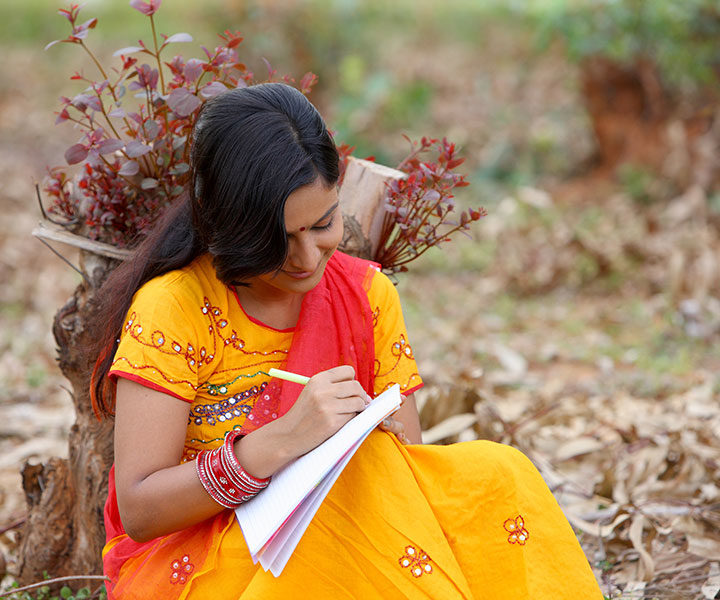 woman writing on paper