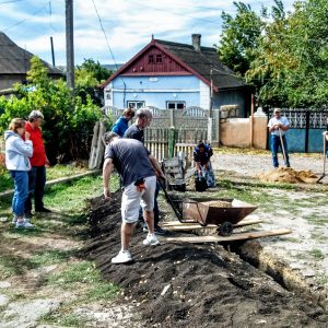 Mixing cement to lay the foundation