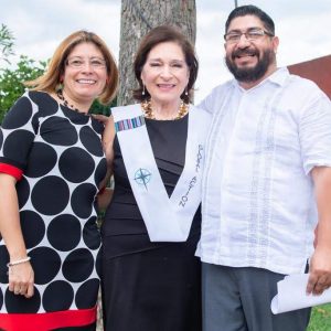 Global Action's Guatemala Directors, Jairo and Andrea Farias, with a graduate of the 2019 Antigua class.