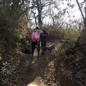 Taking bags of food to villagers on the mountain