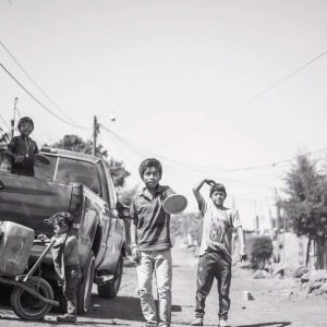 Children on Ruth's street. The cart with the large cartons is for fetching water, since the homes in this village do not have running water.