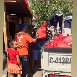 Preparing to distribute food to families in her community