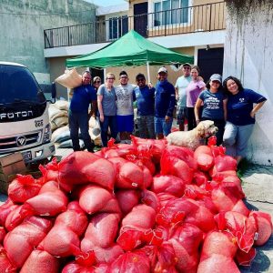 Rich and Cherry with a team of local ministry workers after packing bags for distribution