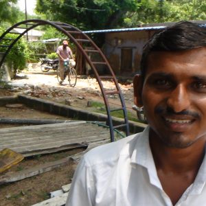 Bagari stands in front of the church building, where Global Action classes are held among the Banjara tribe