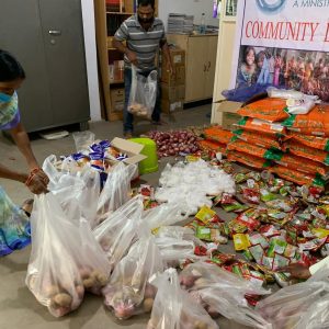 Packaging food to take to the widows in the lepers' slum