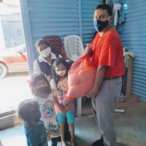 Pastor Marco distributes food