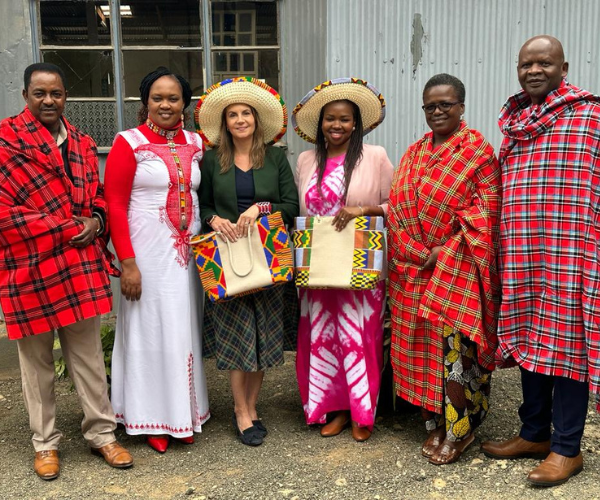 Liz Marvel (center left) and Buhe Mativenga (center right) display traditional Maasai gifts with our Kenyan leadership team