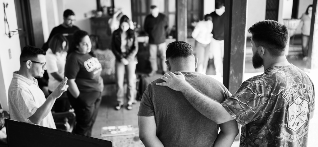 group of individuals praying