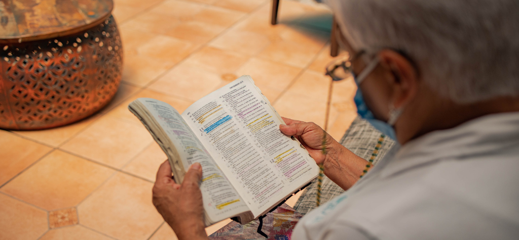 man reading his Bible