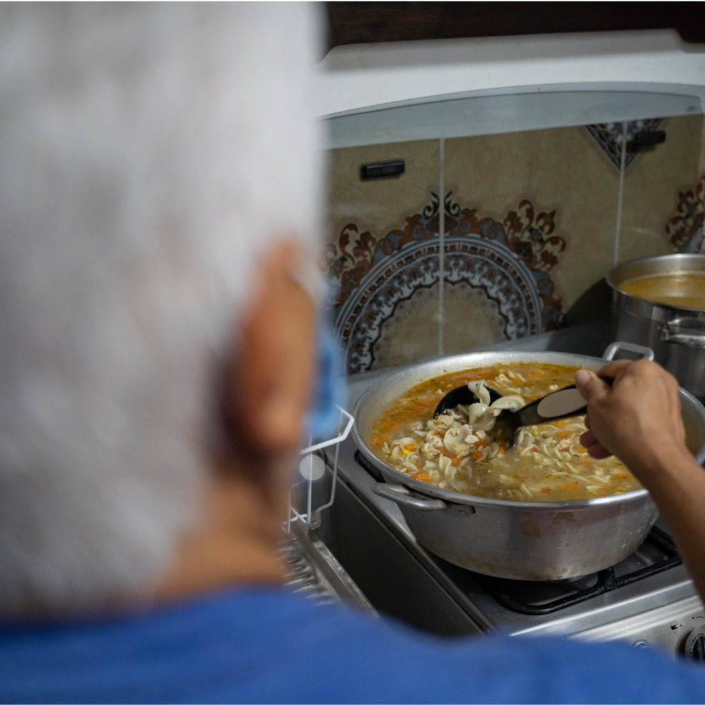 man making soup