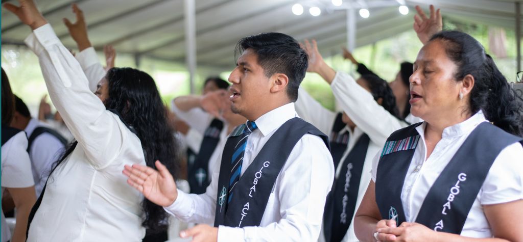 group of students in latin america singing worship songs